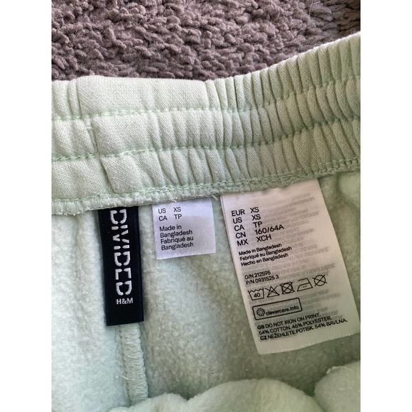 Divided Mint green joggers with purple smiley face, size XS - Picture 4 of 7
